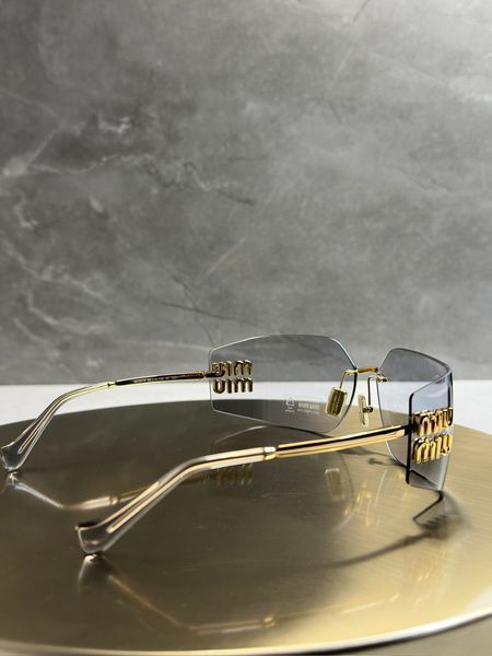 Сонцезахисні окуляри Miu Miu SMU54Y золоті світло-сіра лінза жіночі