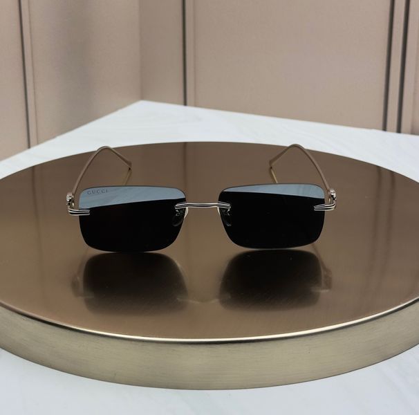 Окуляри сонцезахисні Gucci GG1703S срібні безободкові, прямокутні, сіро-блакитна лінза, логотип GG, унісекс GUC61440 фото