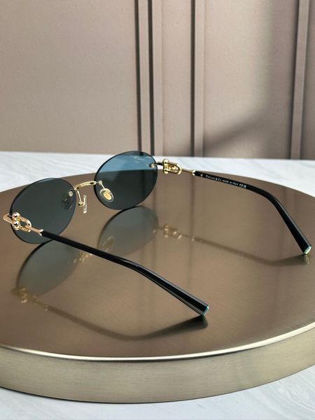 Сонцезахисні окуляри Tiffany & Co TF3104D овальні золоті голуба лінза жіночі
