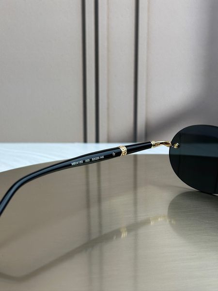 Сонцезахисні окуляри Montblanc MB0415S золото-чорні безоправні овальні чоловічі