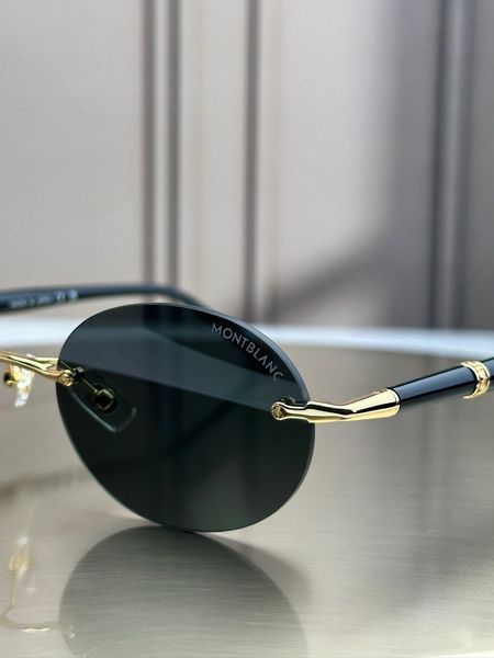 Сонцезахисні окуляри Montblanc MB0415S золото-чорні безоправні овальні чоловічі