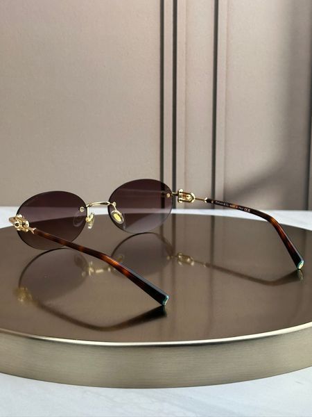 Сонцезахисні окуляри Tiffany & Co TF3104D овальні золоті коричнева лінза жіночі