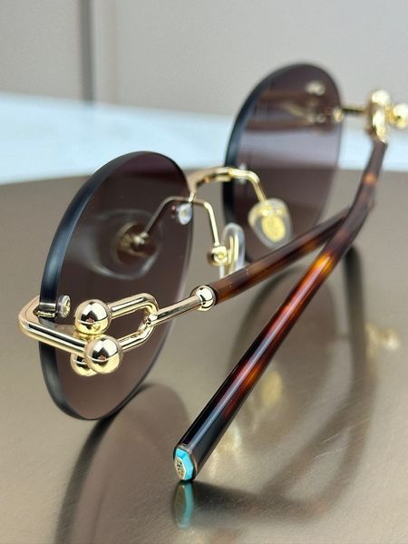 Сонцезахисні окуляри Tiffany & Co TF3104D овальні золоті коричнева лінза жіночі