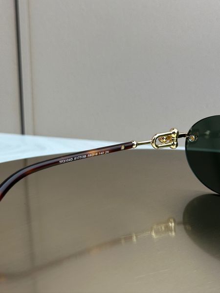 Сонцезахисні окуляри Tiffany & Co TF3104D безоправні овальні золоті жіночі