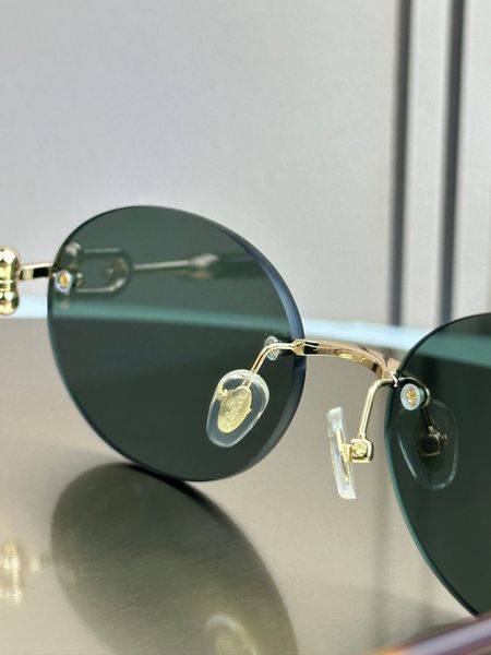 Сонцезахисні окуляри Tiffany & Co TF3104D безоправні овальні золоті жіночі