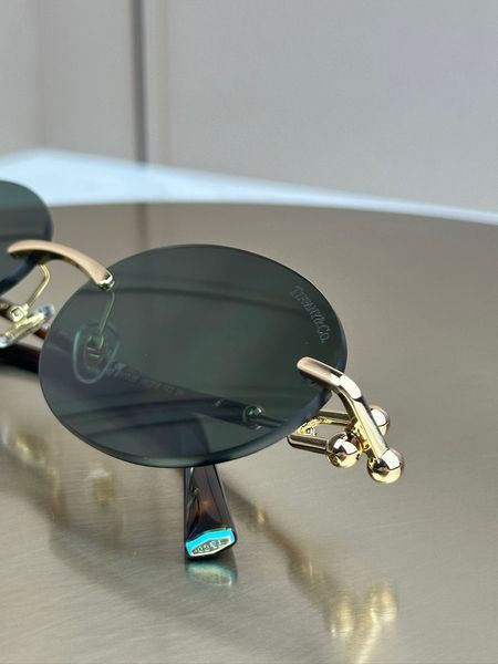 Сонцезахисні окуляри Tiffany & Co TF3104D безоправні овальні золоті жіночі