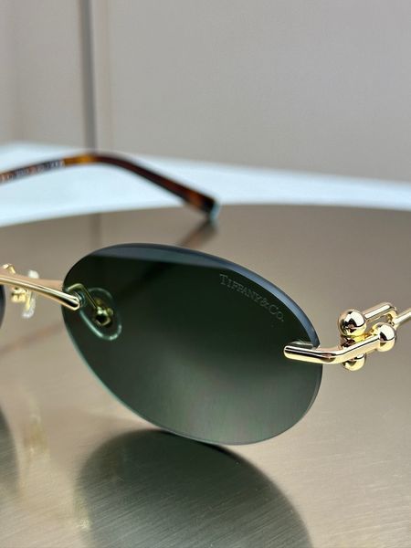 Сонцезахисні окуляри Tiffany & Co TF3104D безоправні овальні золоті жіночі