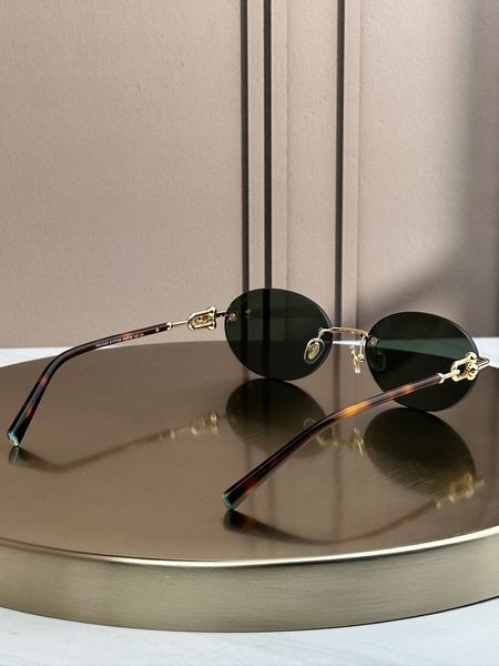 Сонцезахисні окуляри Tiffany & Co TF3104D безоправні овальні золоті жіночі