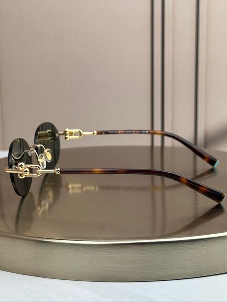 Сонцезахисні окуляри Tiffany & Co TF3104D безоправні овальні золоті жіночі