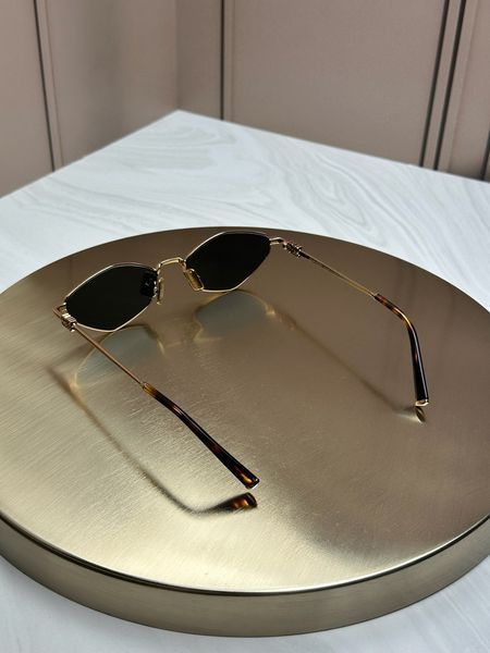 Сонцезахисні окуляри Miu Miu SMU 56Z золоті ромбоподібні металеві жіночі