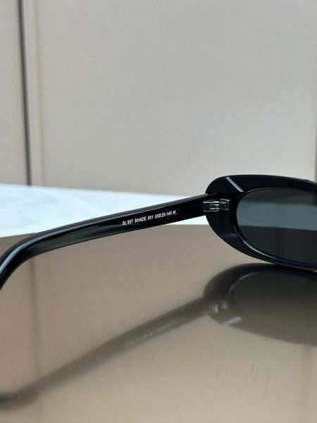 Сонцезахисні окуляри Saint Laurent SL 557 Shade чорні овальні ацетат жіночі