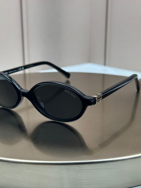Сонцезахисні окуляри Miu Miu SMU 04Z чорні овальні ацетат жіночі