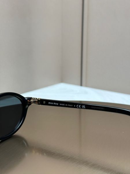 Сонцезахисні окуляри Miu Miu SMU 04Z чорні овальні ацетат жіночі