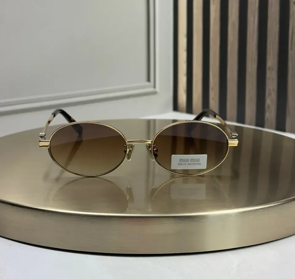 Оригинальные Miu Miu MU 50ZV спереди с заводской наклейкой на линзе