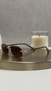 Сонцезахисні окуляри Gucci GG1221S 003 &mdash; безобідкові, коричнева лінза з принтом GG, золоті дужки, унісекс GUC04853 фото
