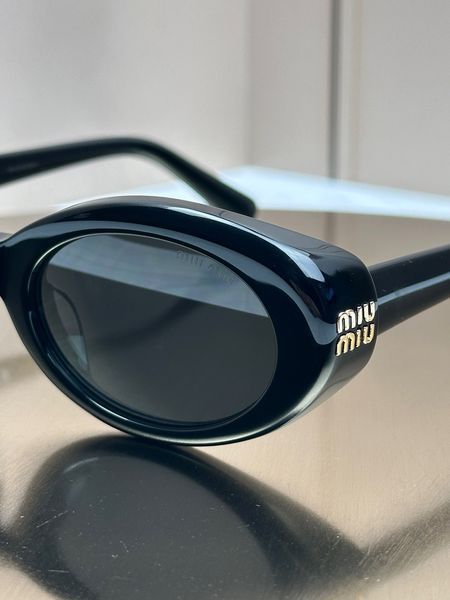 Сонцезахисні окуляри Miu Miu SMU B09 чорні овальні ацетат жіночі