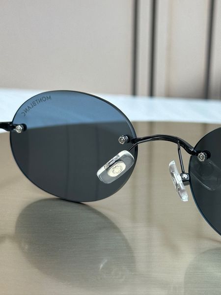 Сонцезахисні окуляри Montblanc MB0415S чорні безободкові овальні синя лінза чоловічі