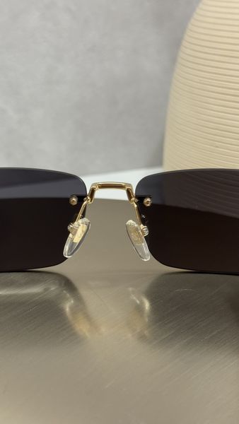 Сонцезахисні окуляри Gucci GG1221S безоправні золото-чорні прямокутні унісекс