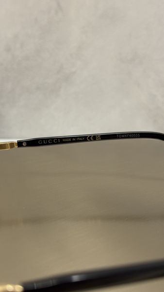 Сонцезахисні окуляри Gucci GG1221S безоправні золото-чорні прямокутні унісекс