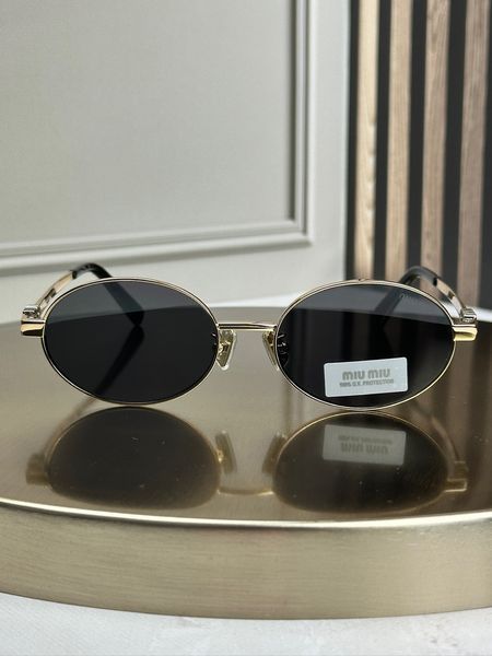 Солнцезащитные очки Miu Miu MU 50ZV золотые овальные металлические, черная линза, женские