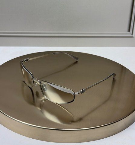 Солнцезащитные очки Miu Miu MUA 50S серебряные узкие овальные полуободковые, коричневая линза, женские