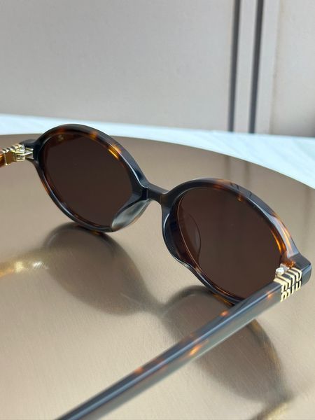 Сонцезахисні окуляри Miu Miu SMU 04Z черепахові овальні ацетат жіночі