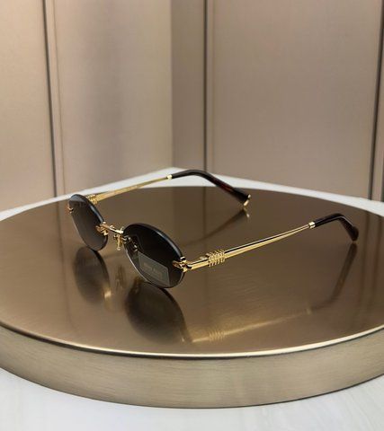 Солнцезащитные очки Miu Miu SMUA54 золотые овальные безободковые металлические, серая линза, женские