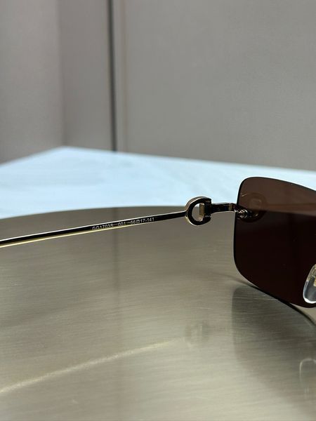 Сонцезахисні окуляри Gucci GG1703S золоті безоправні прямокутні унісекс