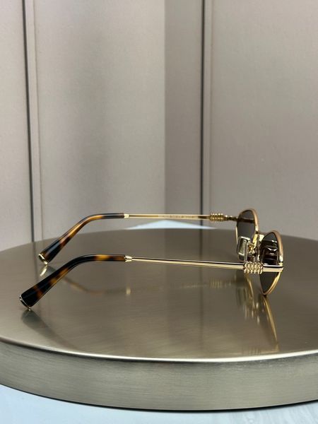 Сонцезахисні окуляри Miu Miu SMU 56ZS золоті ромбоподібні металеві жіночі
