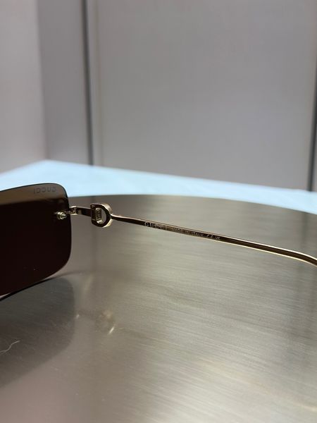 Сонцезахисні окуляри Gucci GG1703S золоті безоправні прямокутні унісекс